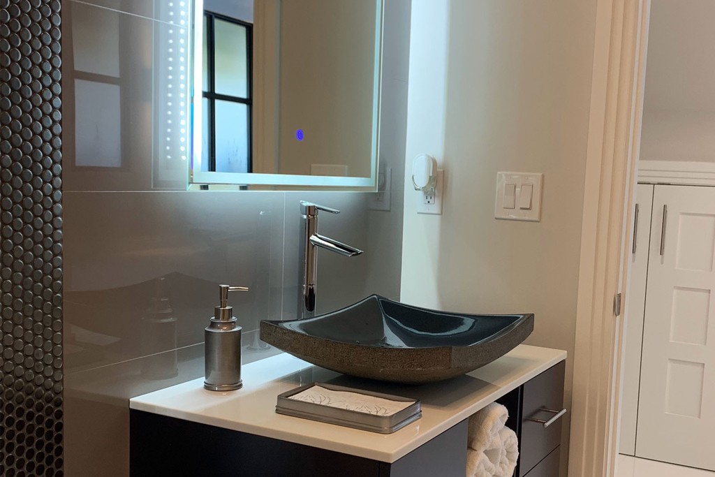 Try using backlit mirrors Home Remodeling Naples Florida